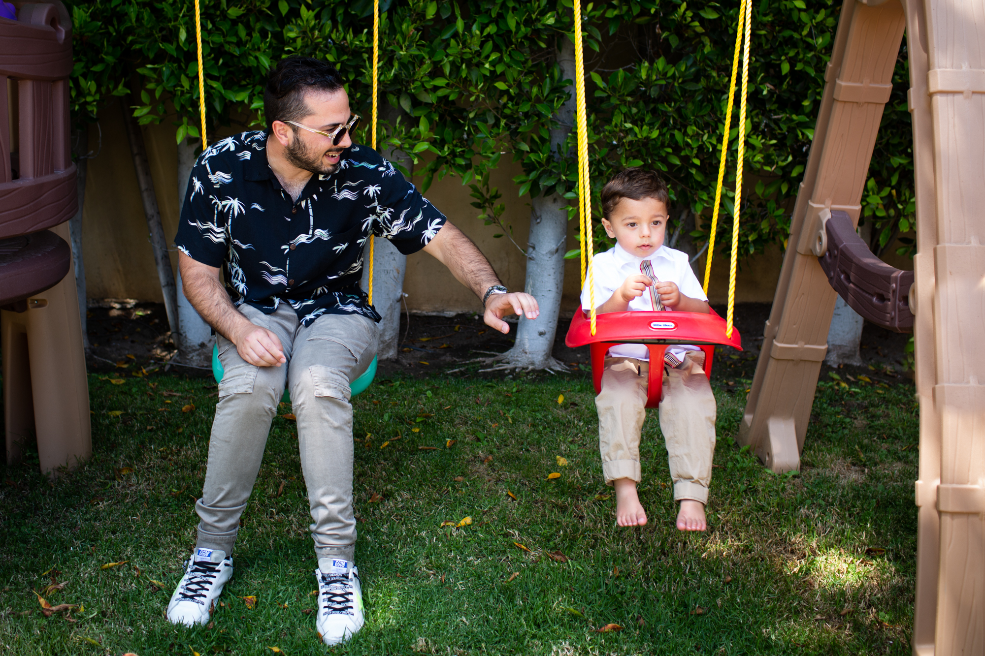 toddler swinging with dad