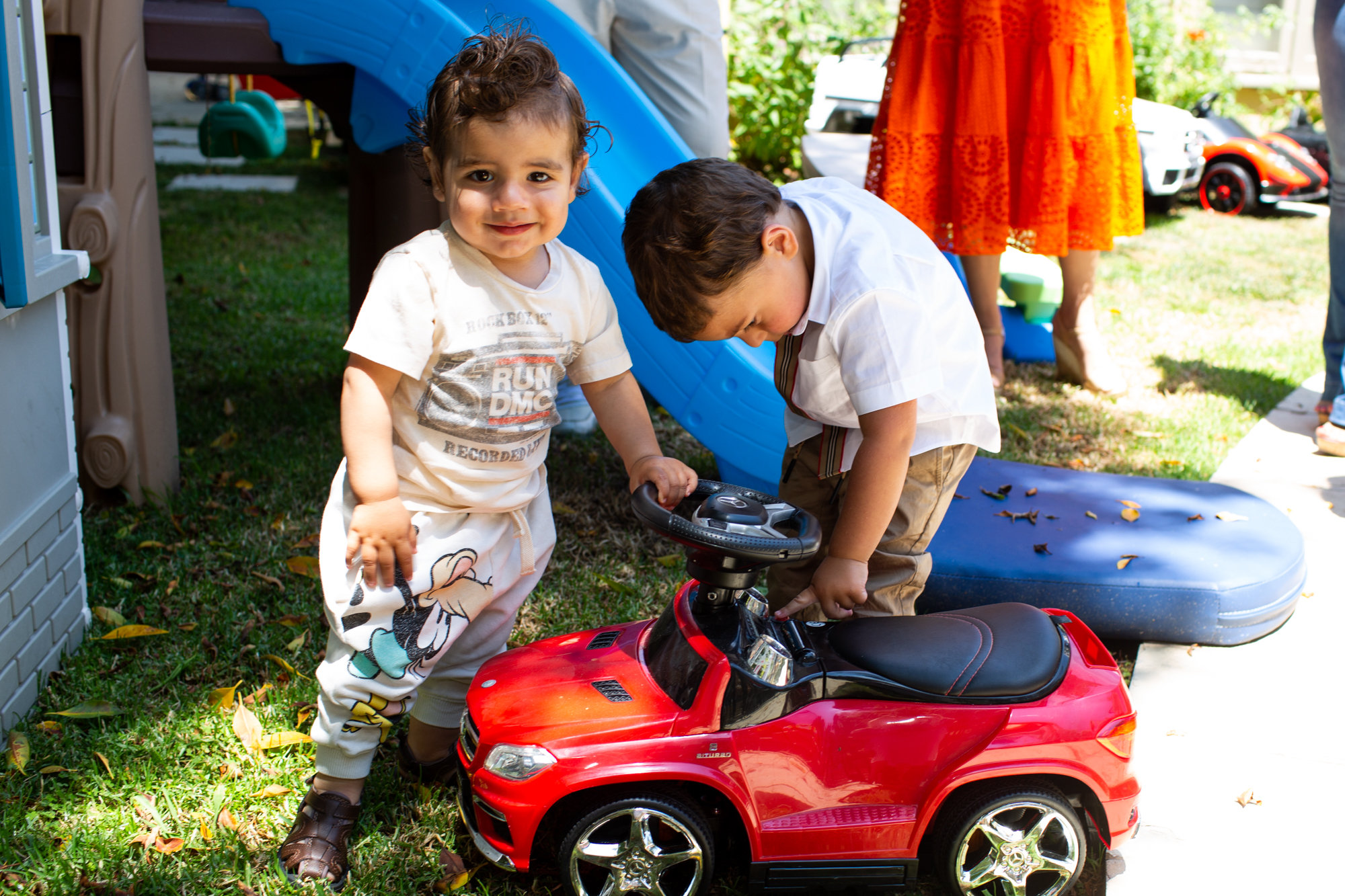 toddlers playing with toy car