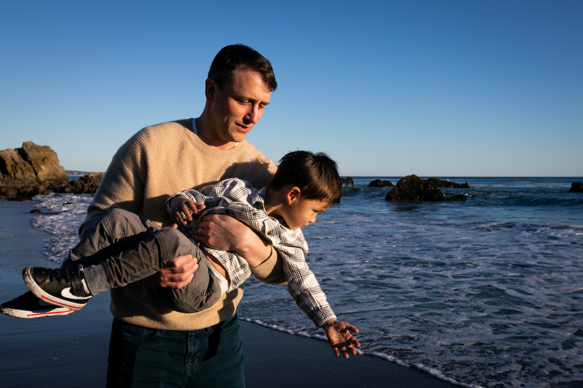 dad plays with son leo carrillo state beach