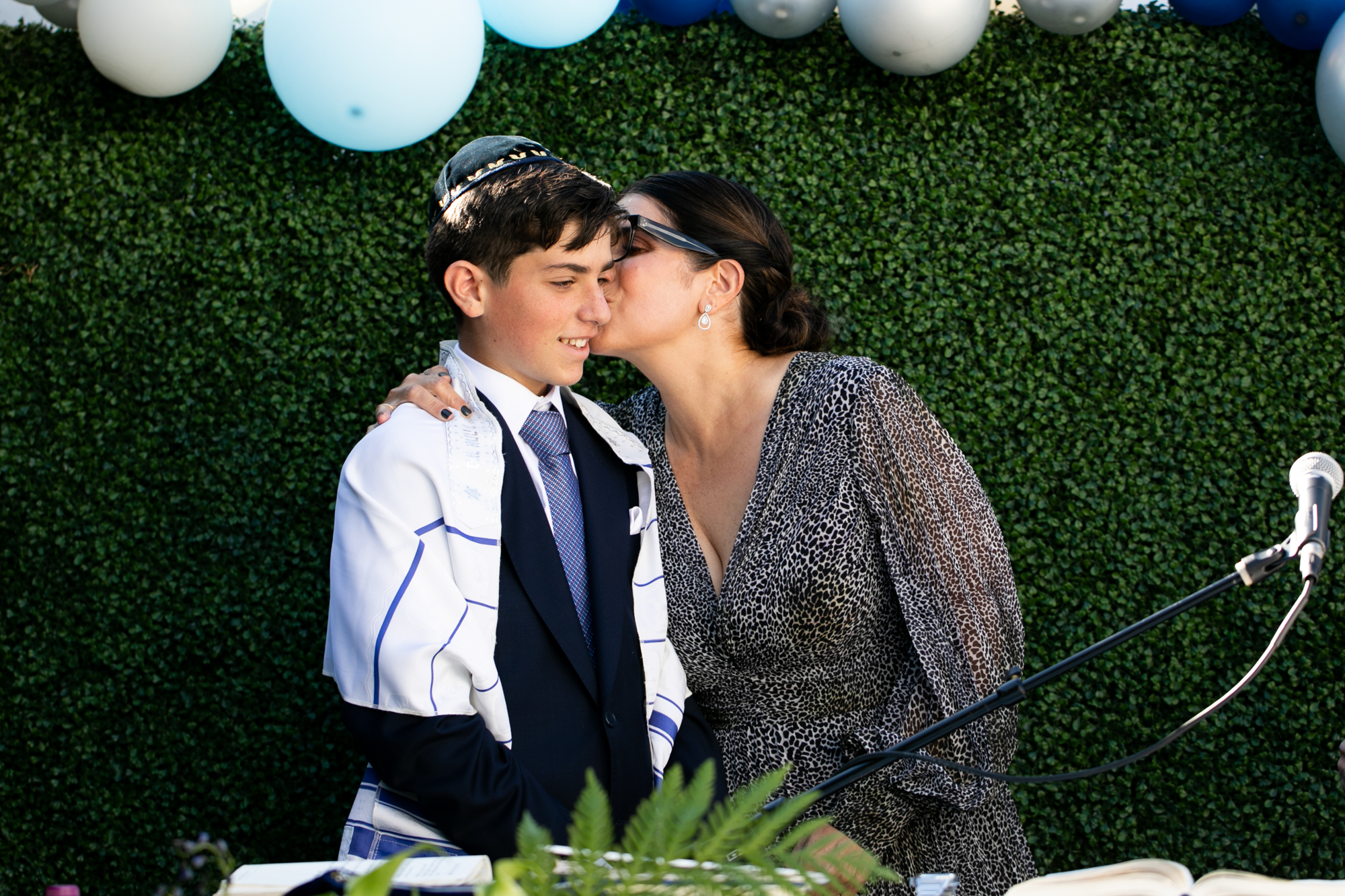 mom kisses son beverly hills bar mitzvah