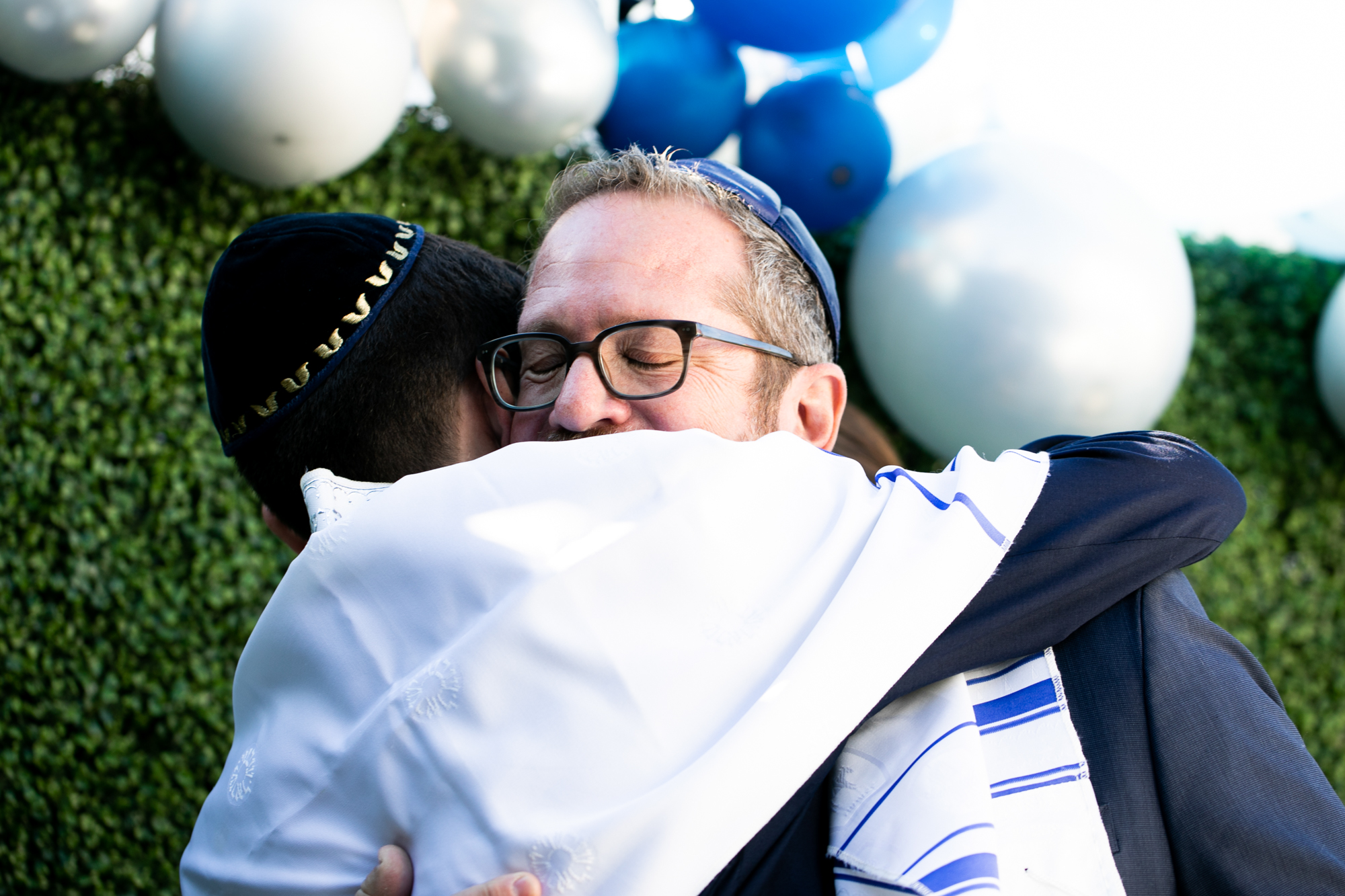 dad hugs son los angeles bar mitzvah
