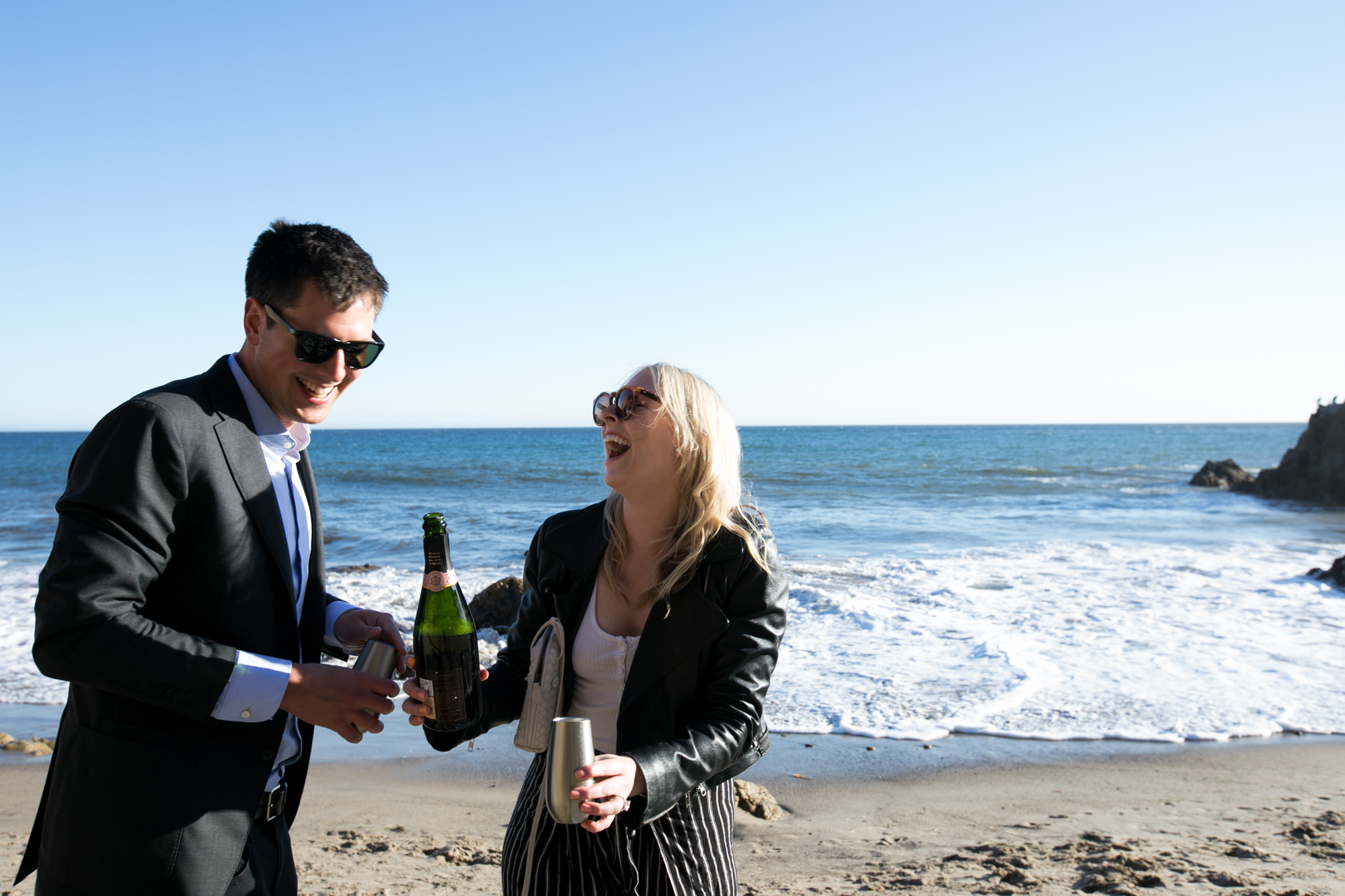 champagne toast at beach malibu proposal
