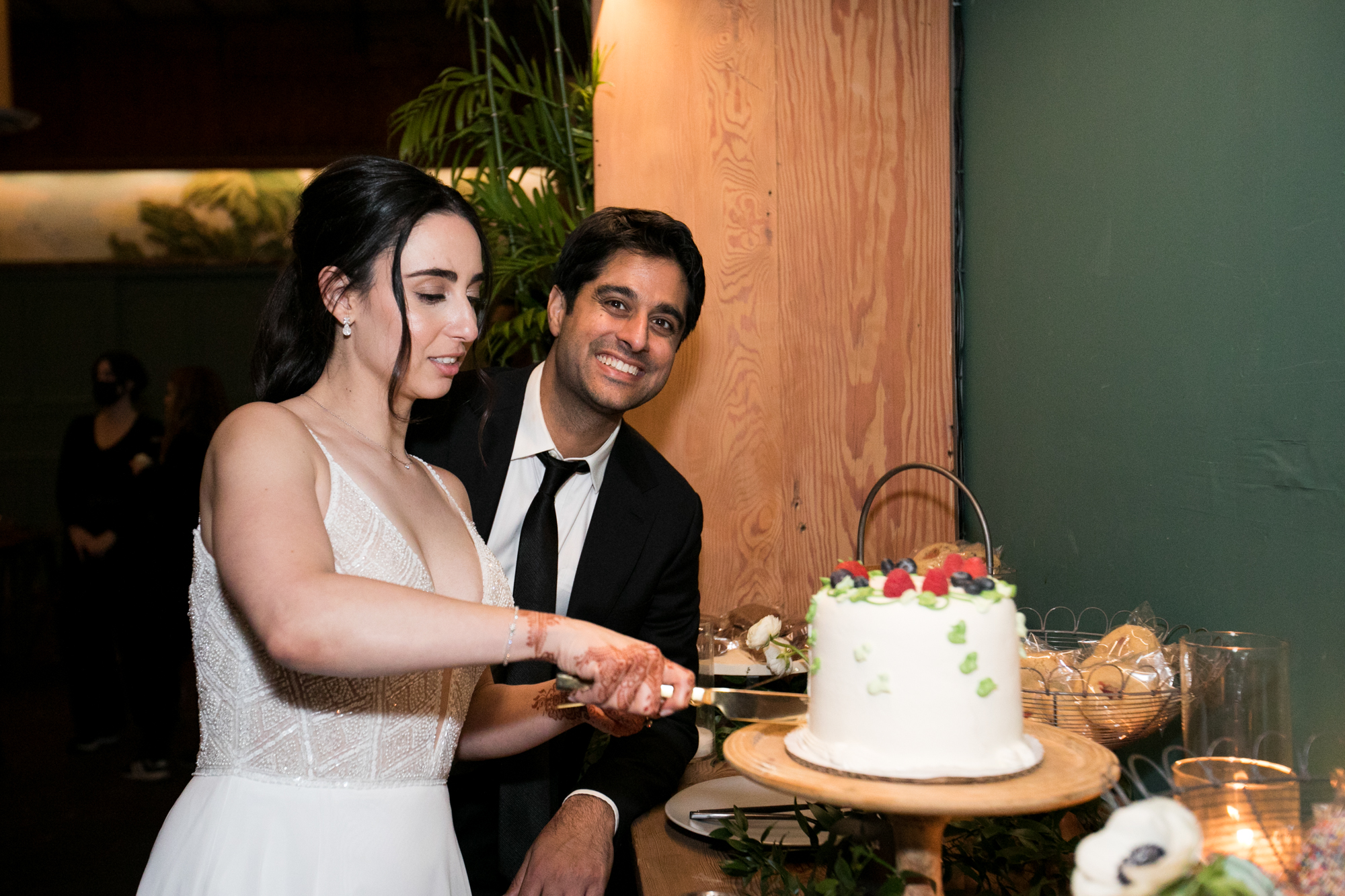 couple cuts cake wedding los angeles
