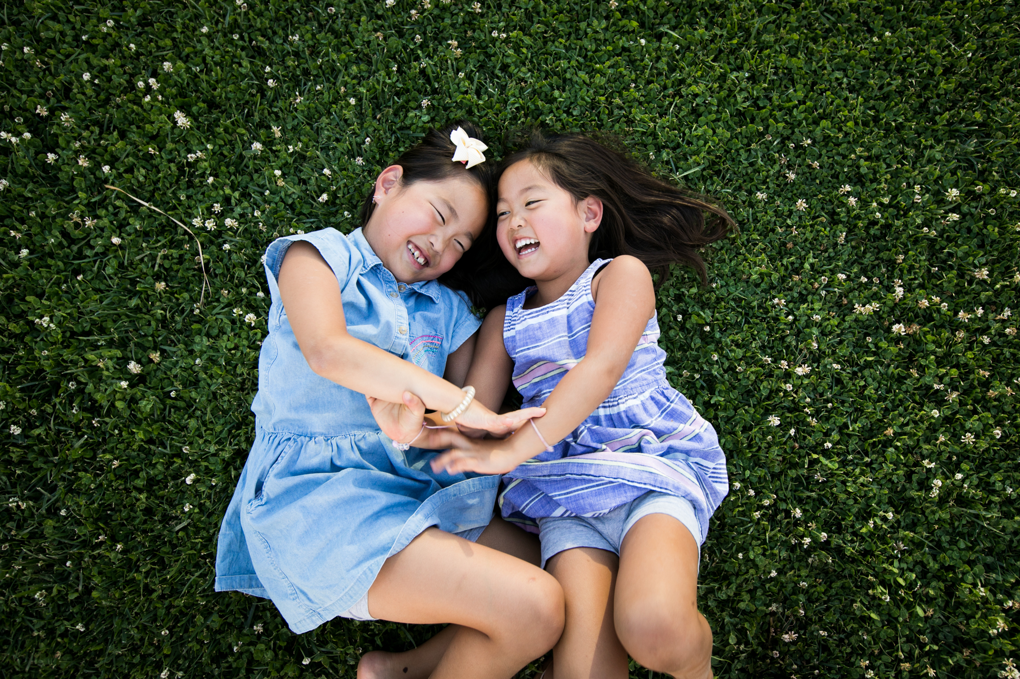 girls giggle in grass beverly hills
